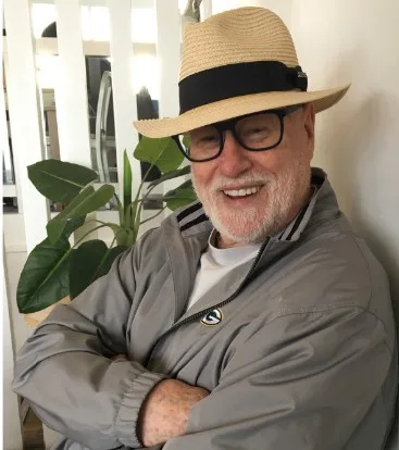 image of the author sitting smiling at the camera wearing a panama hat. About Peter A Hubbard